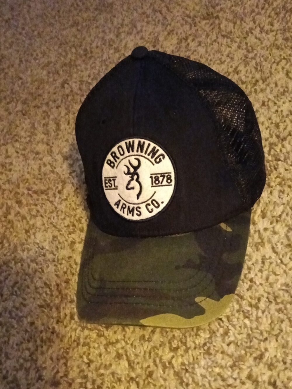 Browning Arms Co. trucker hat featuring a woodland camo